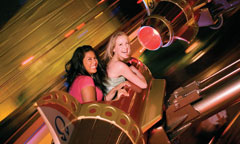 Young Women Riding Astro Orbitor