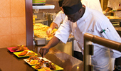 Chefs add the finishing touches to a dish.