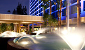  A nighttime shot of the Fantasy Tower fountains at the Disneyland Hotel entrance.