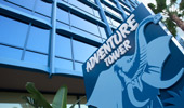 The Adventure Tower sign with an illustration of a safari-style elephant.