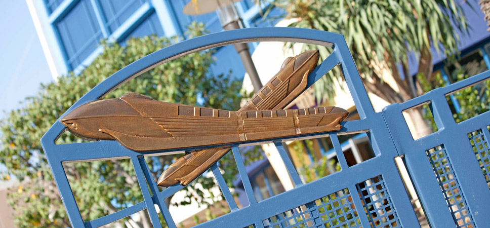 A pair of monorails sculpted on the top of the pool gate