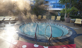 An outdoor hot tub that features design elements from Minnie, like her bow.