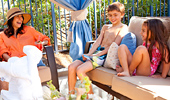 A family of 4 has fun inside the poolside retreat.