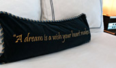 Throw pillow stitched with this saying, 
