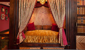 A plush and velvety reading nook with leopard print pillows.
