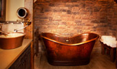 Wash room with vanity and tub.
