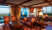 Living and dining areas, complete with model pirate ship in glass case.