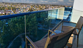 Chairs on a balcony offer an elevated view of the Disneyland Resort.