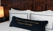 Disney fairy tale touches, like carved headboards and stitched pillows, decorate each room.