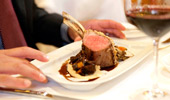 The glowing rose color within a cut braised lamb shank