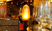 A rose-shaped, hand-blown-glass light fixture