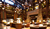 Very wide shot of the expansive lobby with fireplace and seating areas.