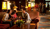 A family discusses the day while seated on the cozy lobby couches.