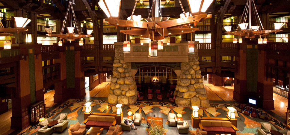 Wide shot of the lobby with the fireplace in the center of the frame.