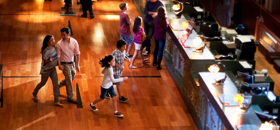 Disney Cast Members at a hotel check-in desk are eager to help make your family vacation unforgettable.
