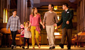A family of 4 enjoys a guided tour of Disney's Californian Hotel & Spa.
