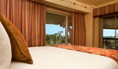 Close up on the warm red and glorious gold bed pillows