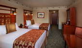 An additional bedroom, with 2 queen-size beds, in the 3-bedroom Artisan Suite