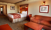 One of the bedrooms with queen-size bed and optional sleeper sofa