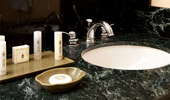 Guest-size bottles of shampoo, conditioner, body butter and soaps