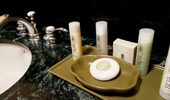 Guest-size bottles of shampoo, conditioner, body butter and soaps