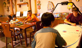 Wide shot of Pinocchio's Workshop with board games and an air hockey table.