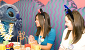 Stitch giggles with 2 girls.