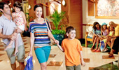 2 families of 4 happily hang out at the hotel lobby.