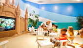 Kids watch programs at the Paradise Theater in Disney's Paradise Pier Hotel.