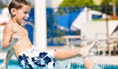 A boy splashes in the Disney's Paradise Pier Hotel pool.