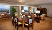 The dining table seats 6 and the living area has plenty of plush seating.