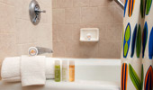 Soap, plush towels and Guest-size bottles of shampoo, conditioner and lotion