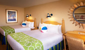 2 queen-size beds and beach-theme decor.