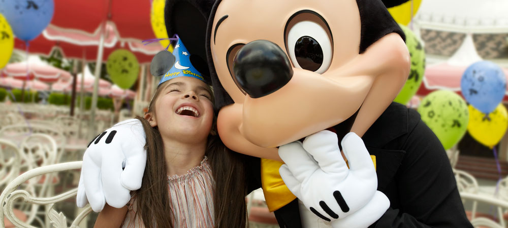 A Girl Laughs with Mickey Mouse